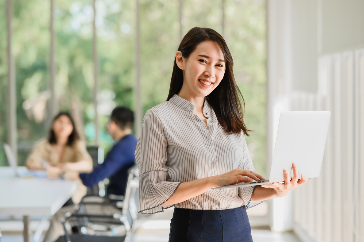 Employee Holding Her Laptop    