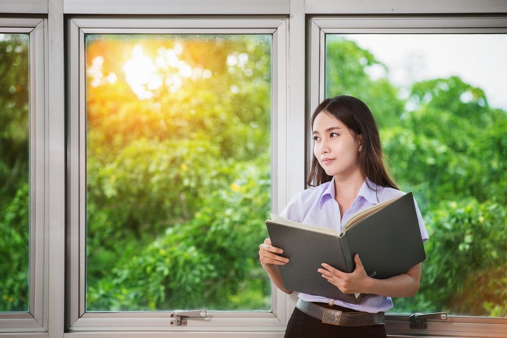 Asia students read a book
